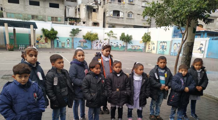 Distributing jackets for orphaned and poor children